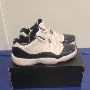 Jordan 11 Retro Low in White and Black with Emerald Highlights